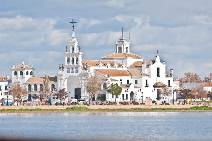 Large white building, El Rocío Hermitage, near a body of water